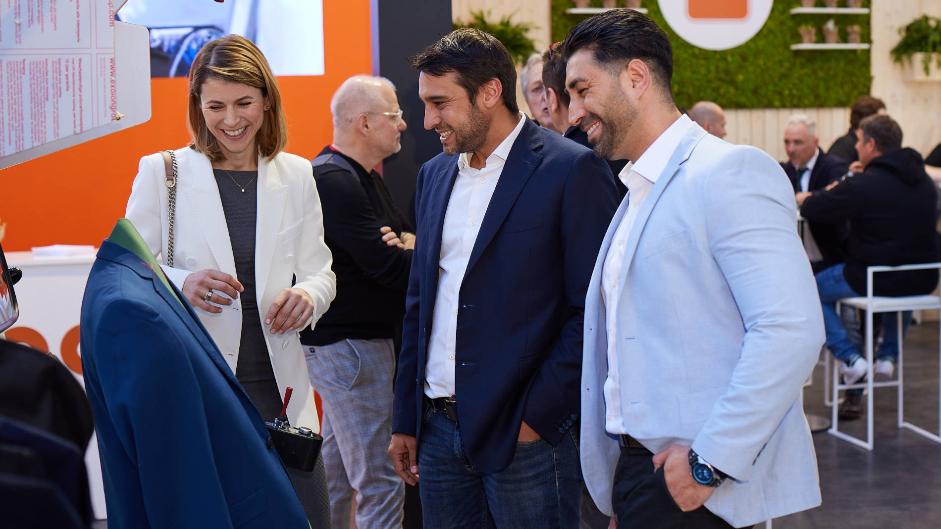 People looking at a suit